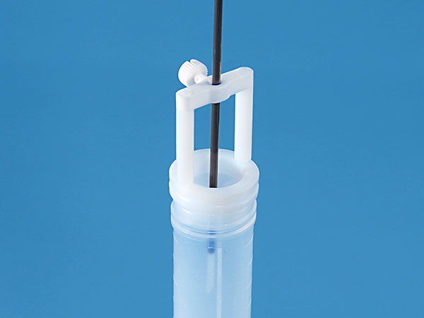 Holder for sample probe made of TFM